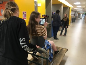 Students block the action before shooting the Dolly Shoot